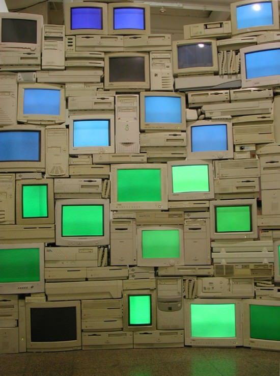 a room filled with lots of different types of tvs