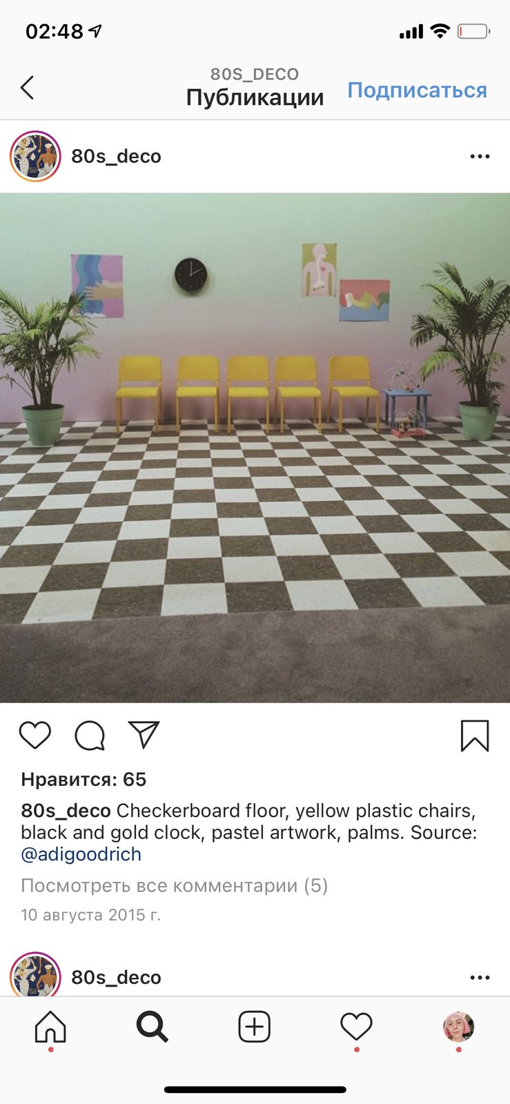 a room with a checkerboard floor, yellow chairs, and potted plants