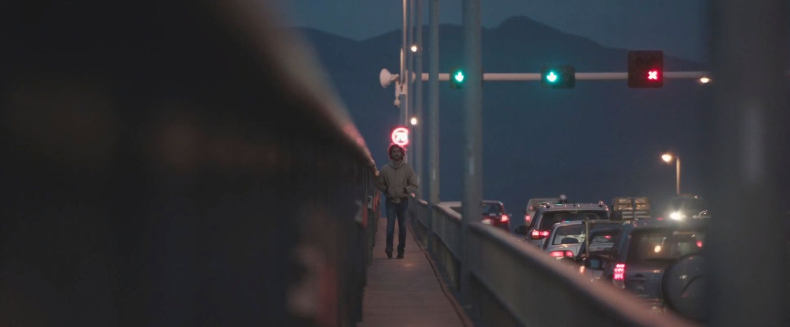 a traffic light that is green on a bridge