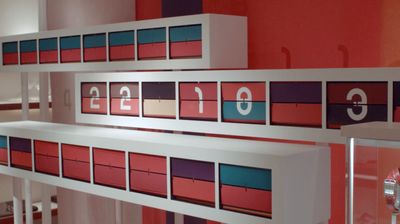 a display of numbers and numbers on a wall