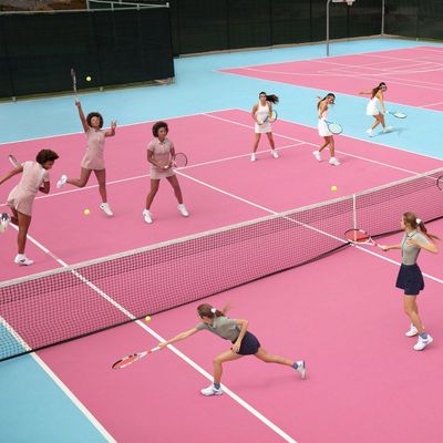 a group of women playing a game of tennis