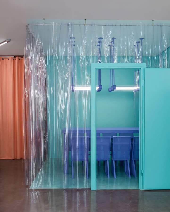 a room with plastic covering the walls and chairs