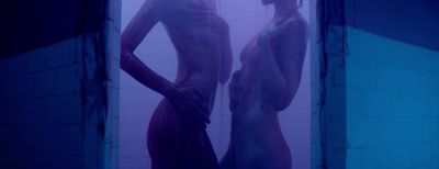 a couple of naked women standing next to each other