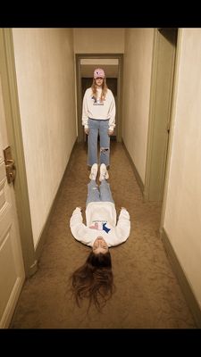 a woman laying on the floor next to a woman laying on the floor