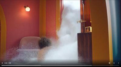 a person in a bath room with steam coming out of it