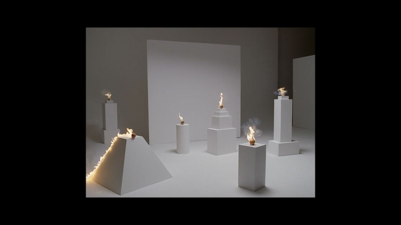 a group of white candles sitting on top of a table