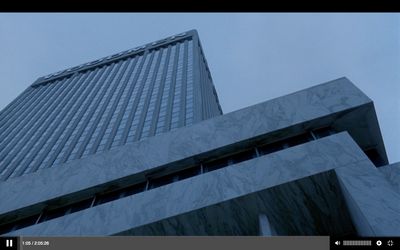 a tall building with a sky background