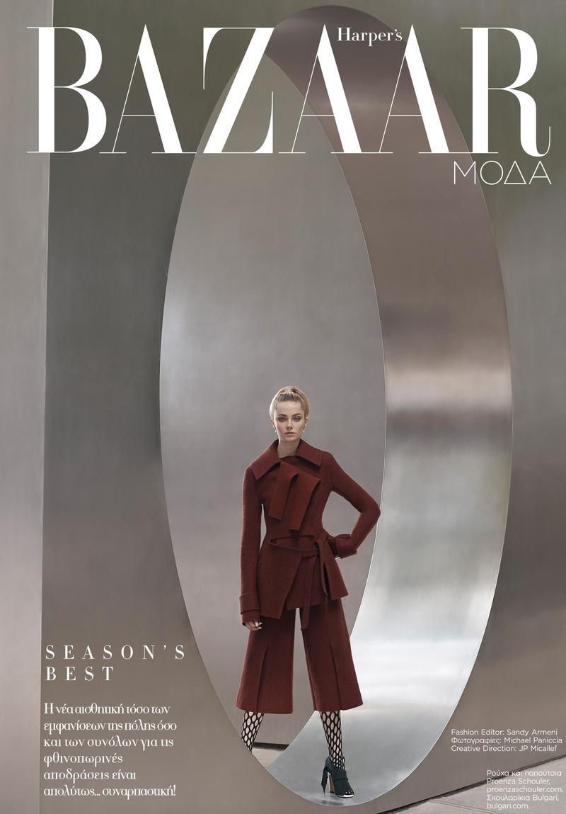 a magazine cover with a woman in a red coat