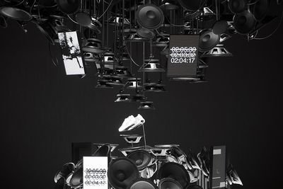 a black and white photo of a bunch of speakers