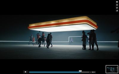 a group of people standing around a gas station