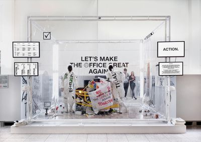 a group of people standing around a display case