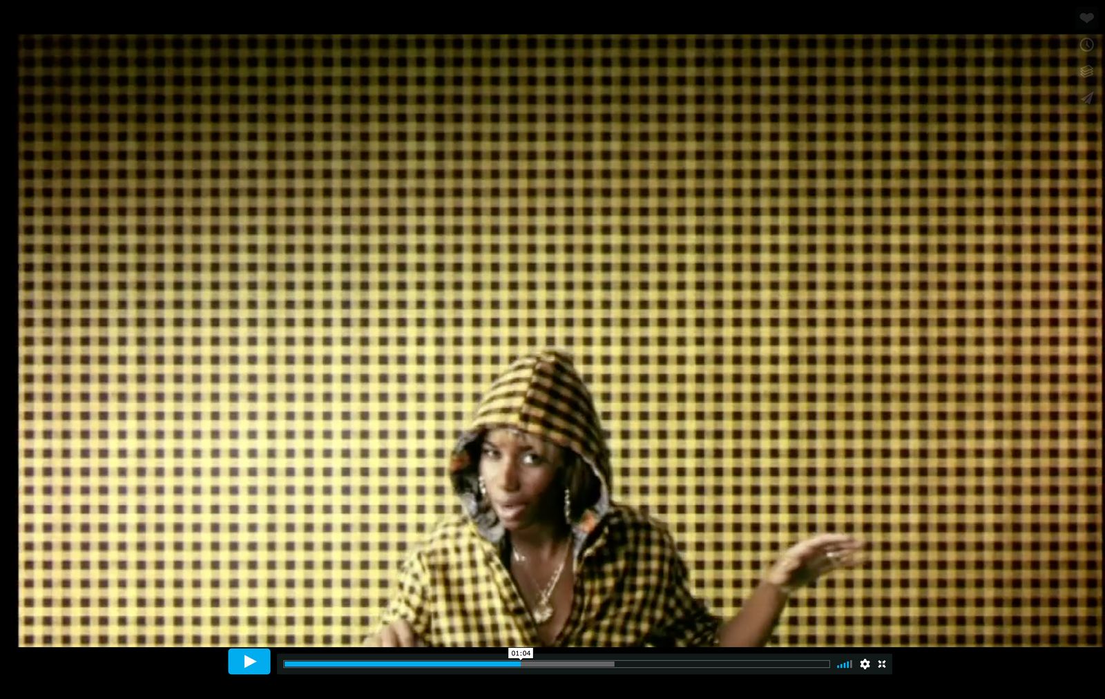 a woman in a yellow and black shirt and hat