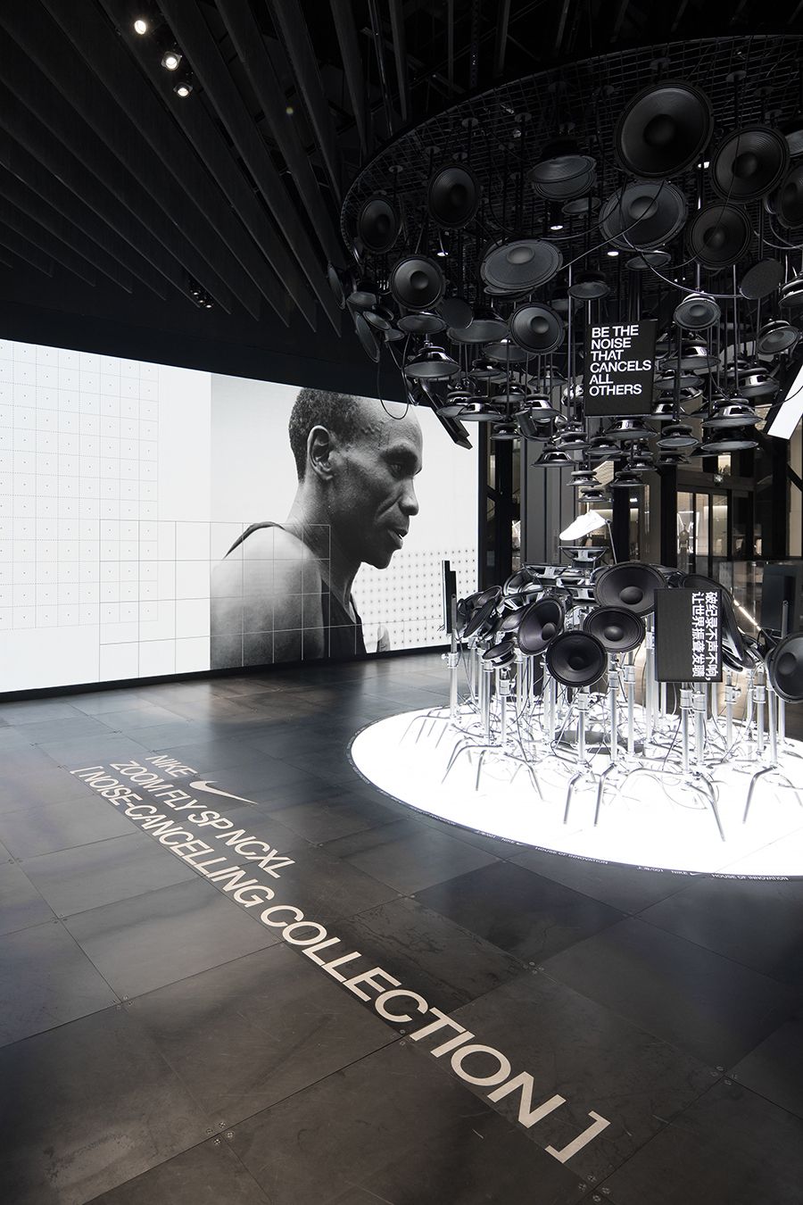 a black and white photo of a room with a lot of speakers