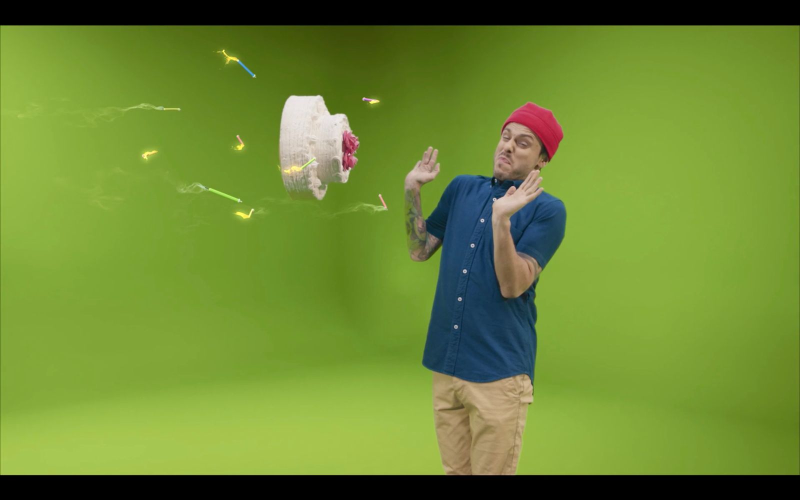 a man standing in front of a green screen