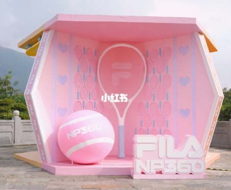 a pink tennis court with a ball and racket