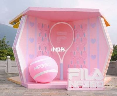 a pink tennis court with a ball and racket