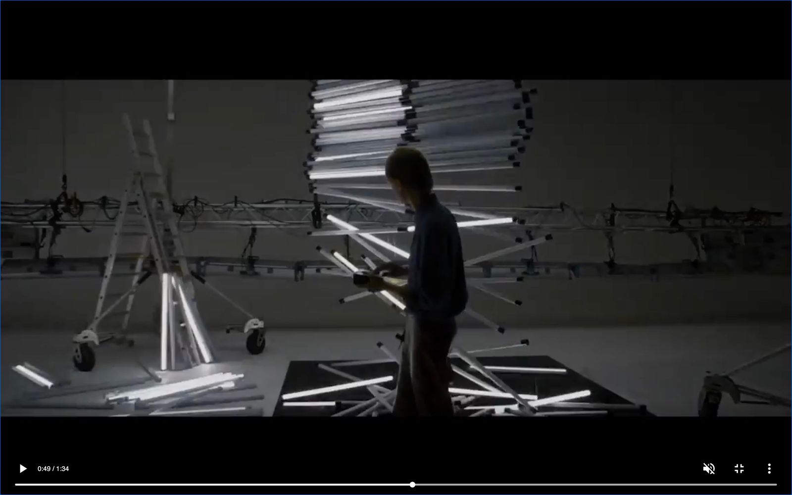 a man standing in front of a display of wires