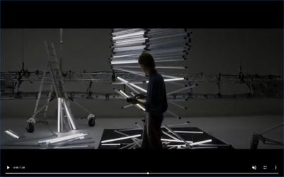 a man standing in front of a display of wires