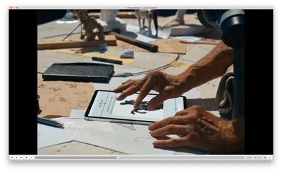 a person using a tablet on top of a table