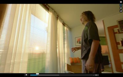 a man is standing in front of a window