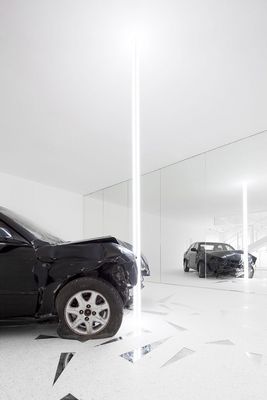 a car that is sitting in the middle of a room