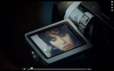 a camera with a picture of a woman on the screen