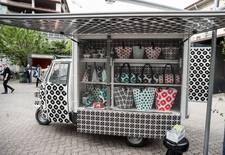 a white and black truck with lots of bags on it