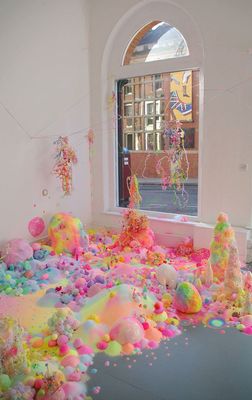 a room filled with lots of colorful confetti