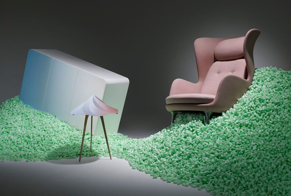 a pink chair and a pink chair on a green carpet