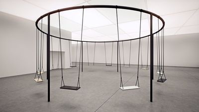 an empty room with a circular swing set