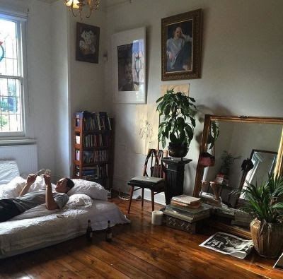 a person laying on a bed in a room