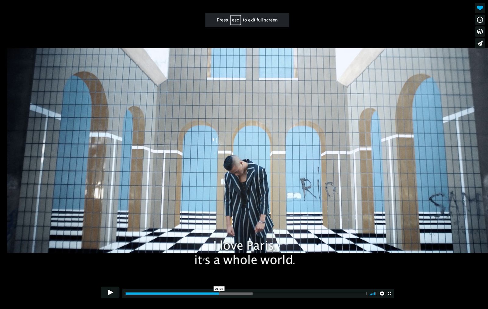 a person standing in a room with a black and white checkered floor