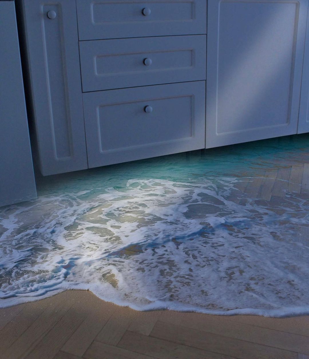 a picture of a bathroom floor with water on it