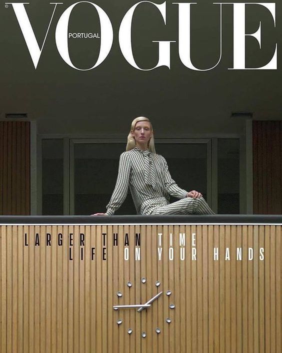 a woman sitting on top of a wooden wall