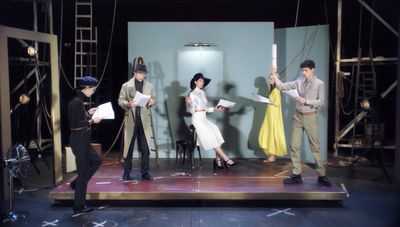 a group of people standing on top of a stage