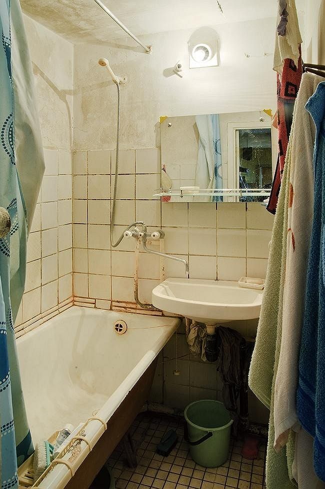 a bathroom with a tub and a sink