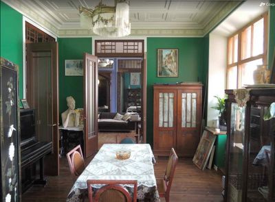 a dining room with a table and chairs