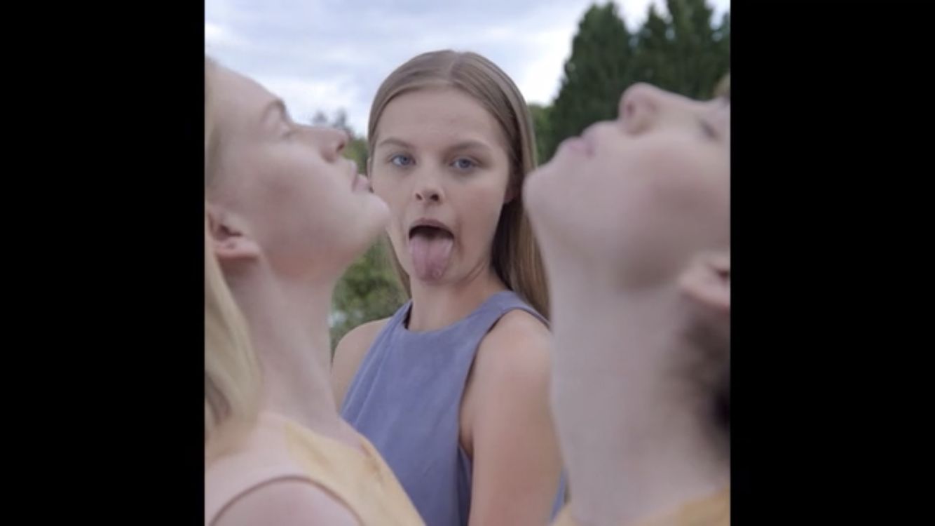 a group of young women standing next to each other