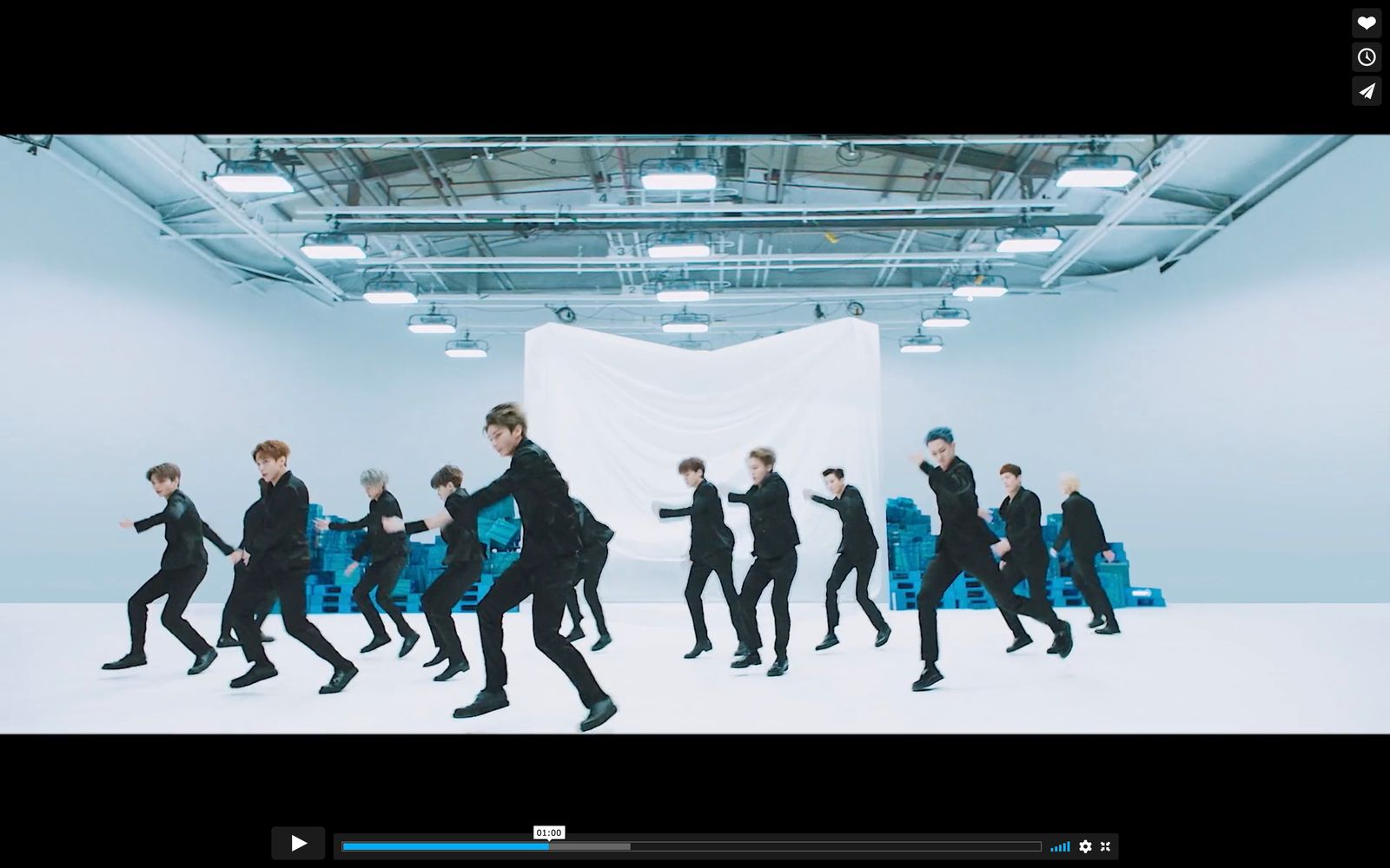 a group of young men dancing in a room