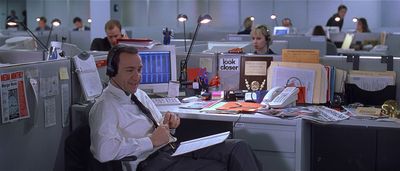 a man sitting at a desk in an office