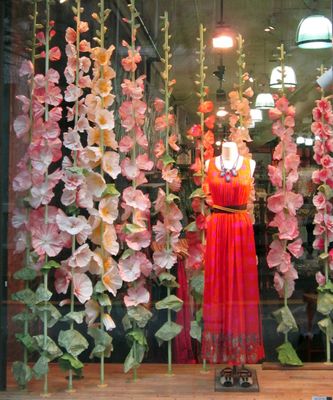 a display of flowers in a store window