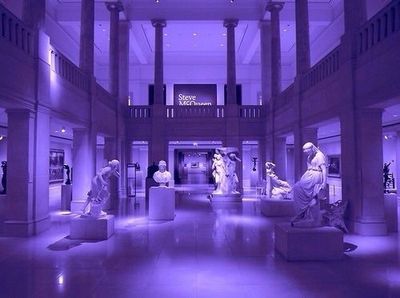 a museum filled with statues of women and men