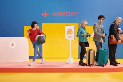 a group of people standing around with luggage