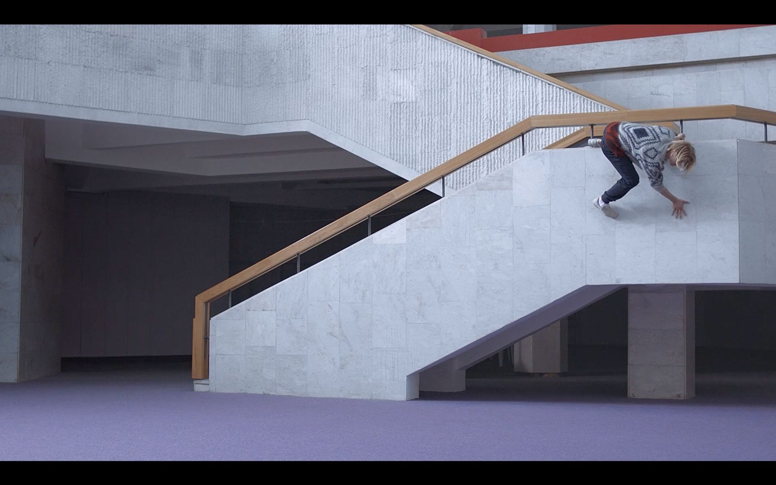 a man riding a skateboard down a set of stairs