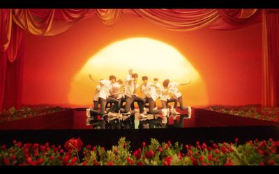 a group of people sitting on top of a stage