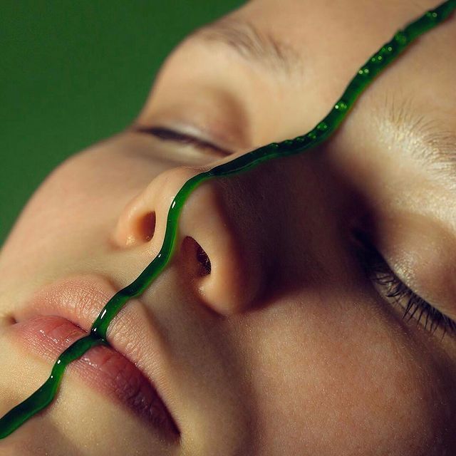 a close up of a child's face with a toothbrush in it '