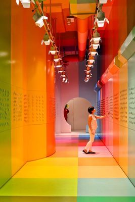 a man is walking through a brightly colored room