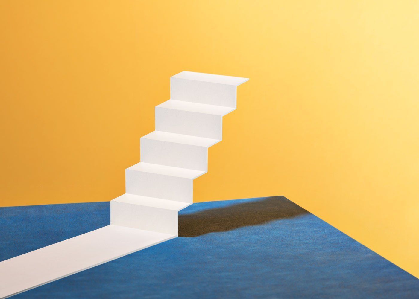 a white staircase on a blue and yellow background