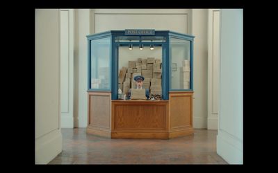 a man sitting at a desk in a room