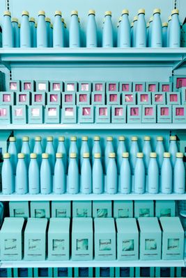 a shelf filled with lots of blue bottles